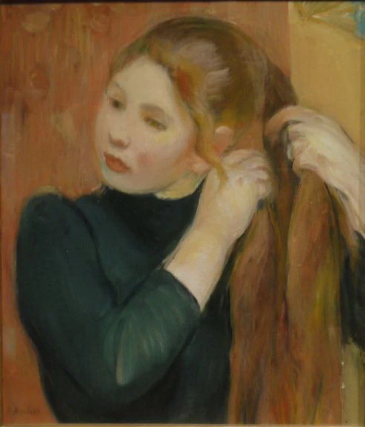 Ragazza che si pettina